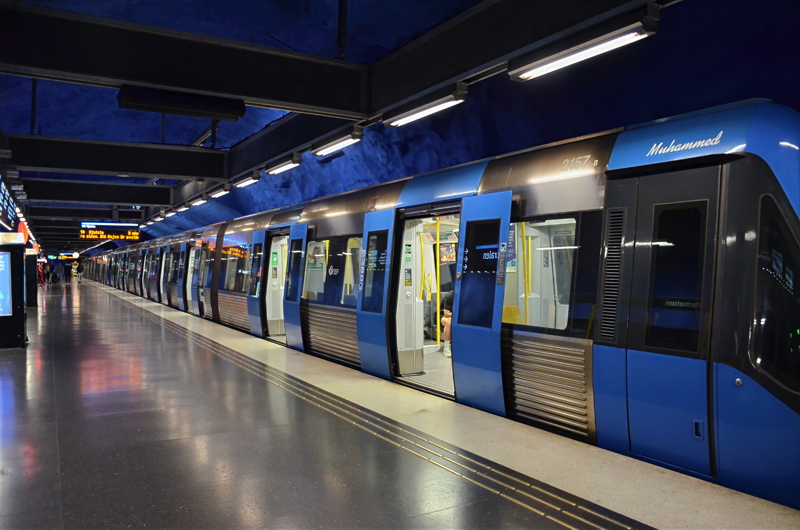10 - A modern blue train, specifically a C30 stock train, docked at an underground station in Stockholm